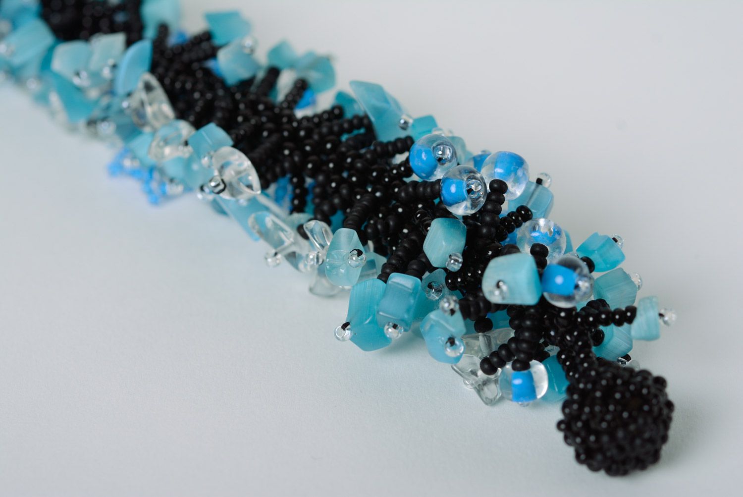 Handmade designer wrist bracelet woven of black and blue beads for women photo 4