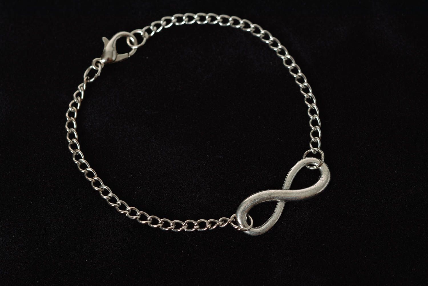 Handmade designer wrist bracelet with metal chain and infinity shaped insert photo 1