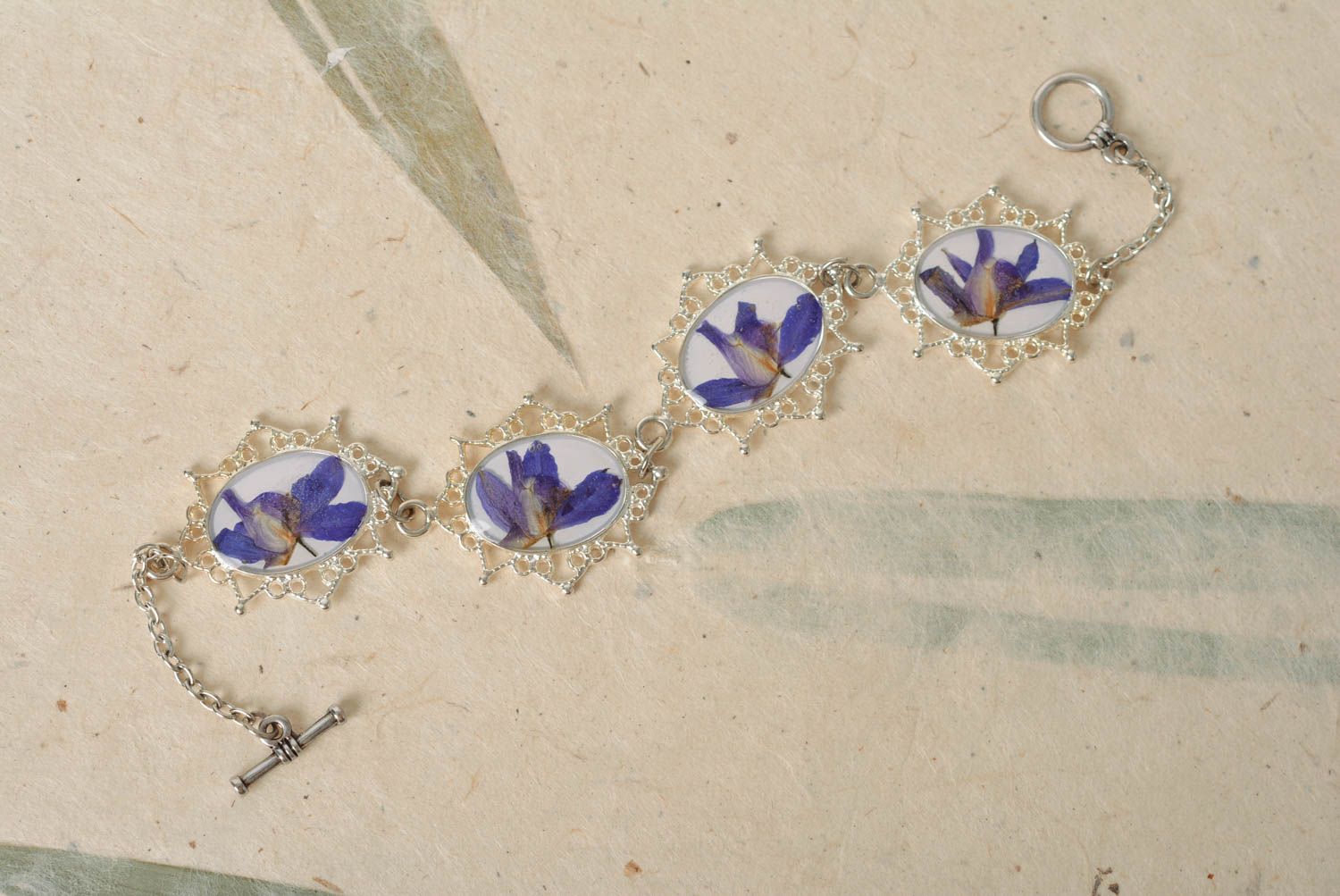 Beautiful handmade women's wrist bracelet with real flowers coated with epoxy photo 2