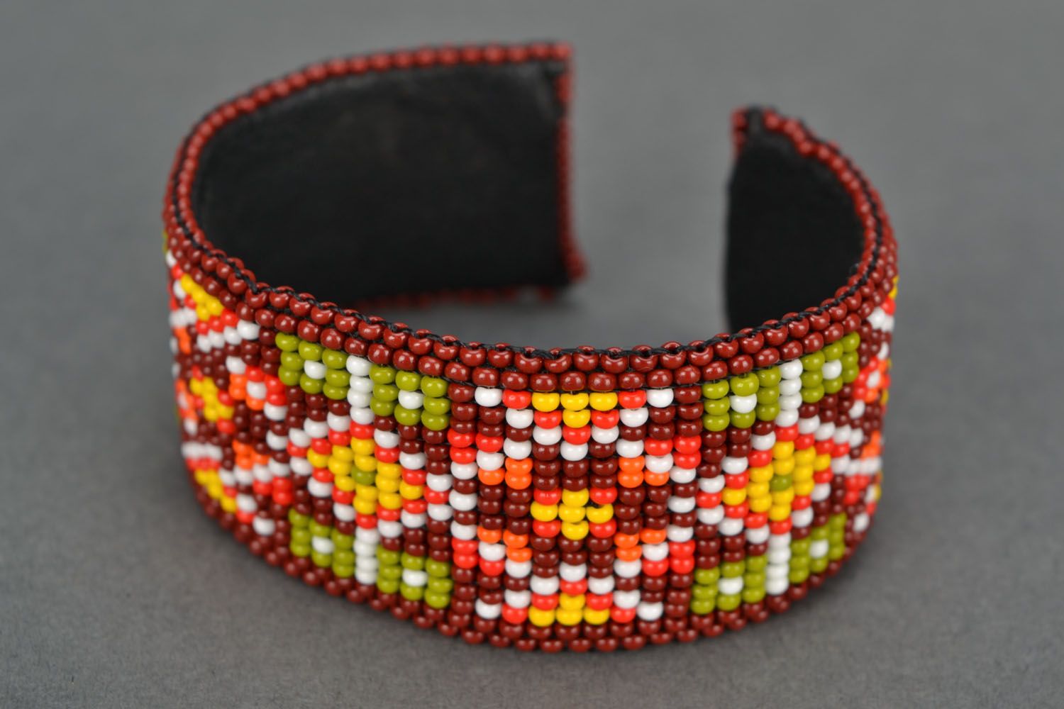 Cuff beaded bracelet in orange dark red and yellow colors photo 4