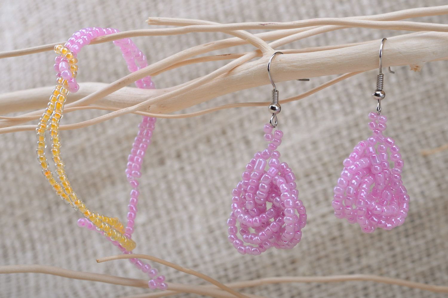 Handmade beaded jewelry set dangle earrings and wrist bracelet of pink color photo 1