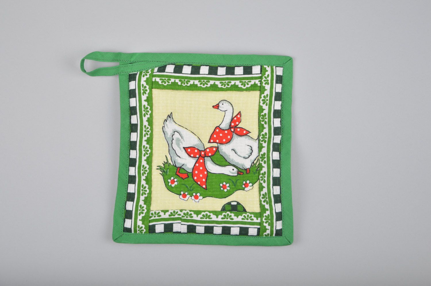 Handmade square pot holder sewn of cotton with geese image in green color palette photo 1