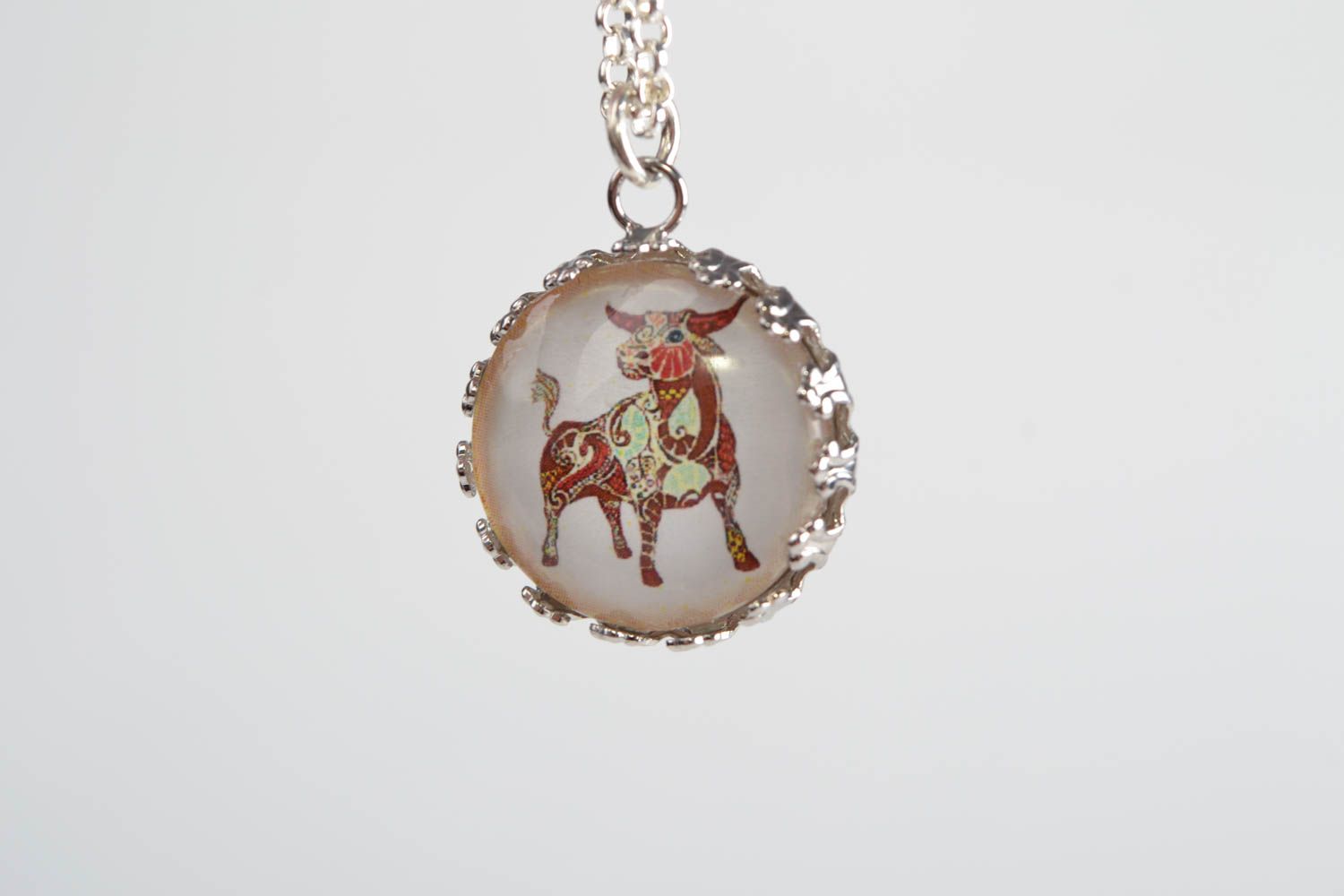 Handmade designer round white glass pendant on chain with image of Taurus photo 4