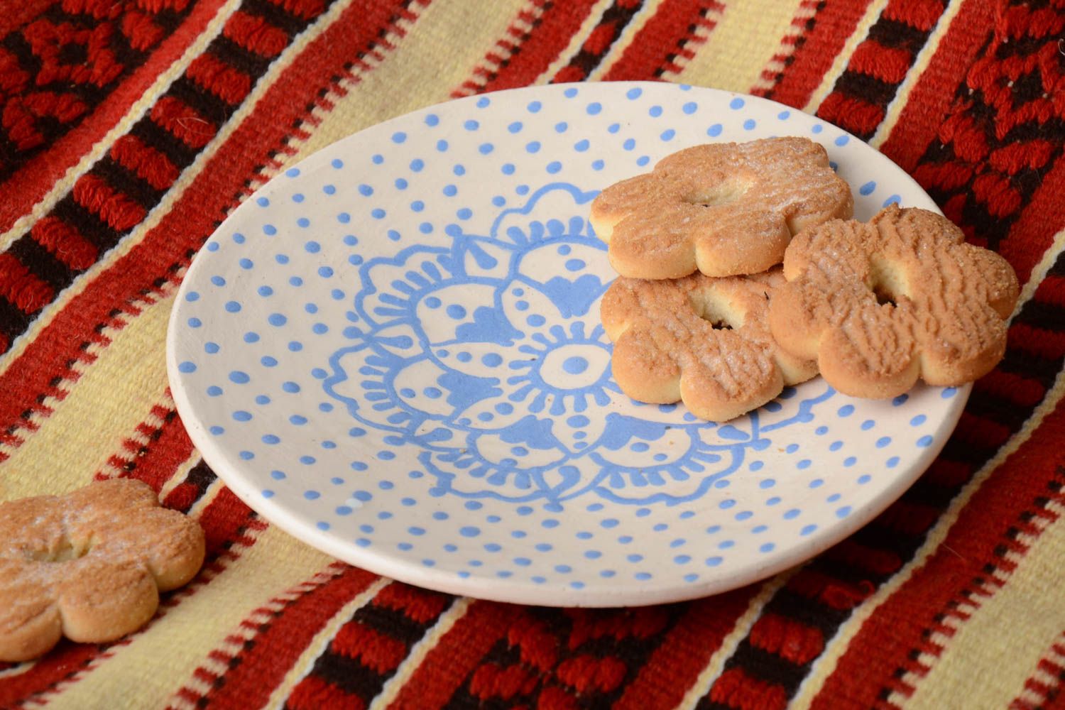 Handmade decorative small glazed white ceramic saucer with blue ornaments photo 1