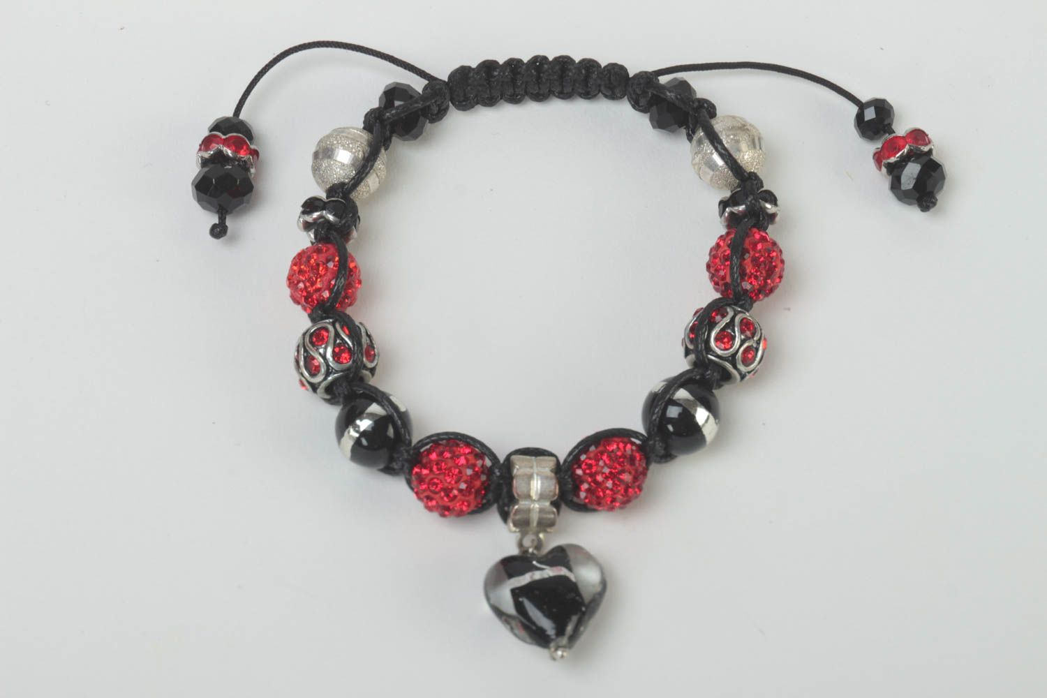 Black rope cord strand bracelet with black, red beads and heart-shaped charm photo 1