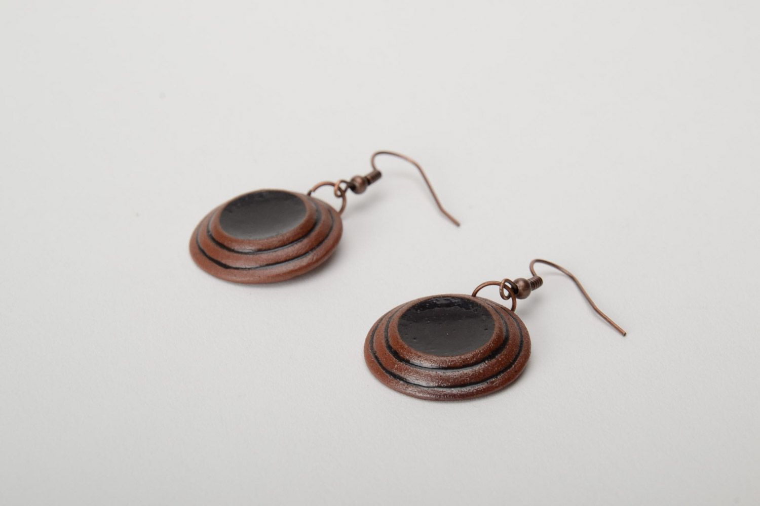 Handmade brown ceramic dangle earrings of round shape painted with enamels photo 5