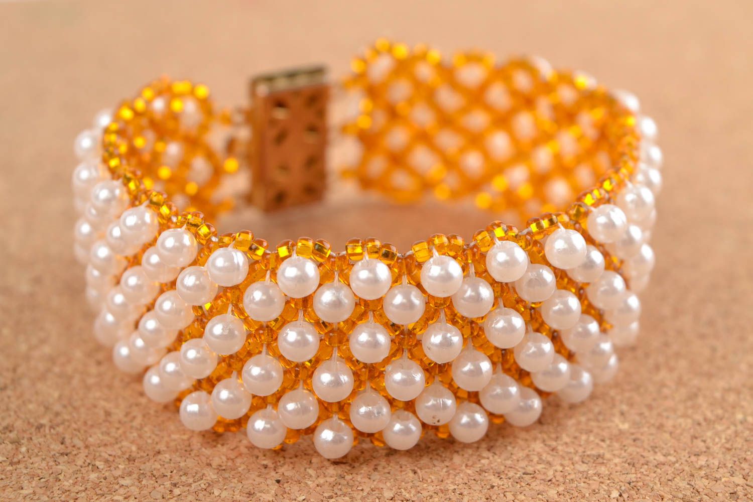 Handmade beaded wide bracelet in golden and white colors photo 1