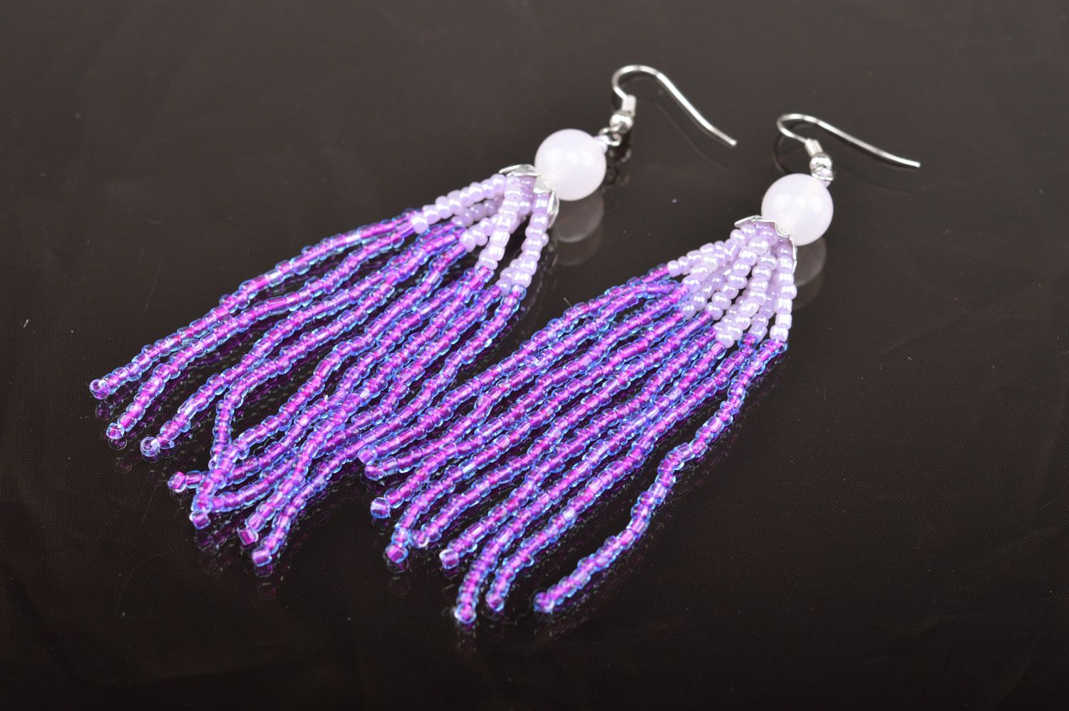 Handmade women's lilac long beaded earrings with charms  photo 5