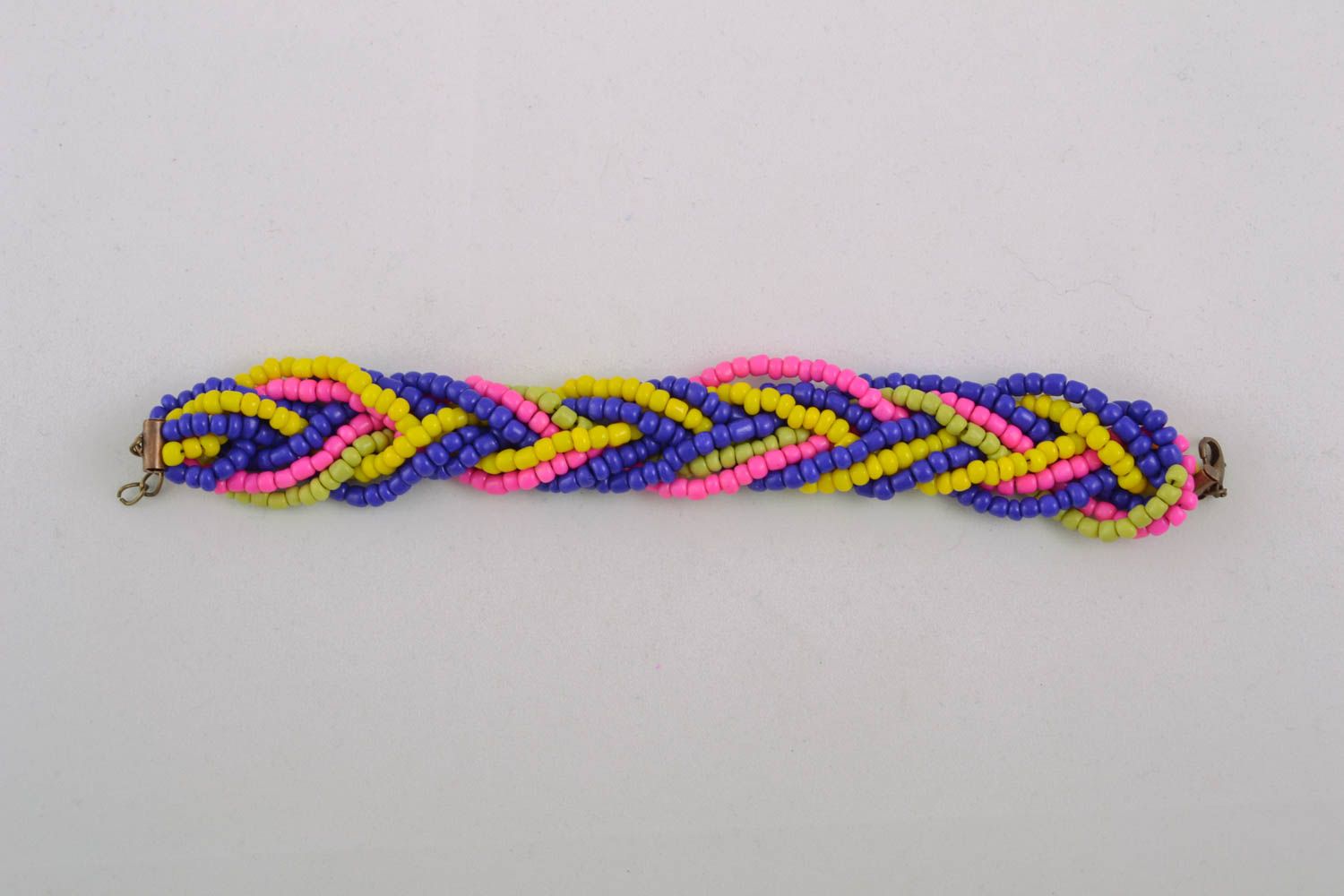 Blue, red, yellow beaded bracelet in the shape of pigtail photo 1