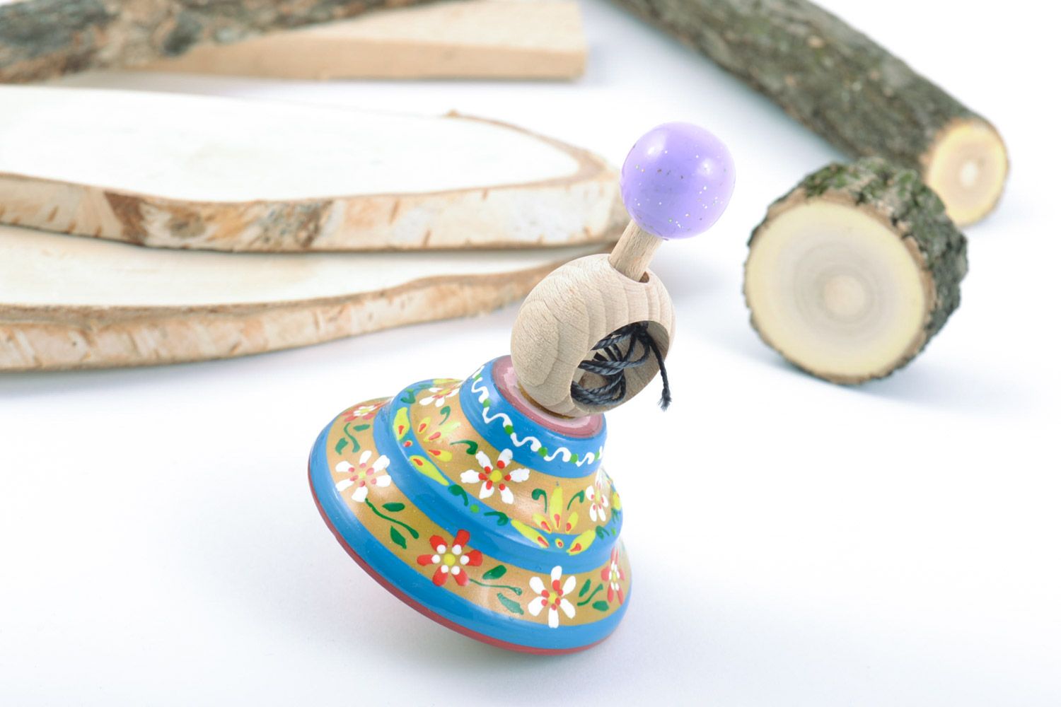 Petit jouet toupie fait main en bois naturel de hêtre multicolore à motif floral photo 2