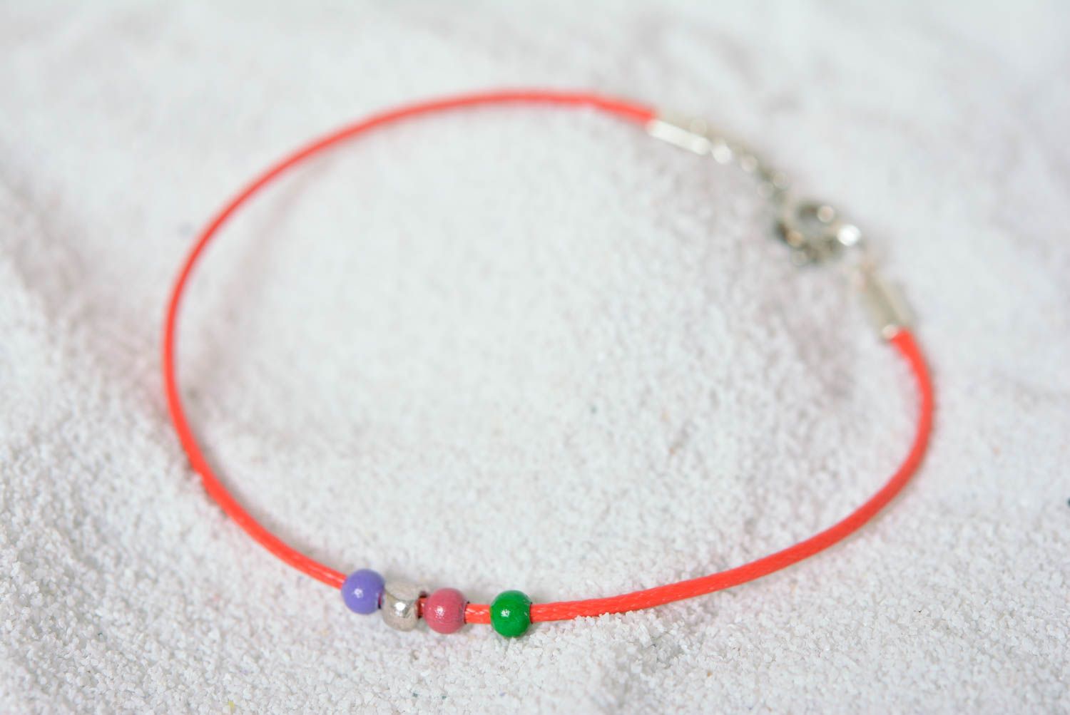 Handmade thin red bracelet cord with blue, green, blue, and silver beads photo 1