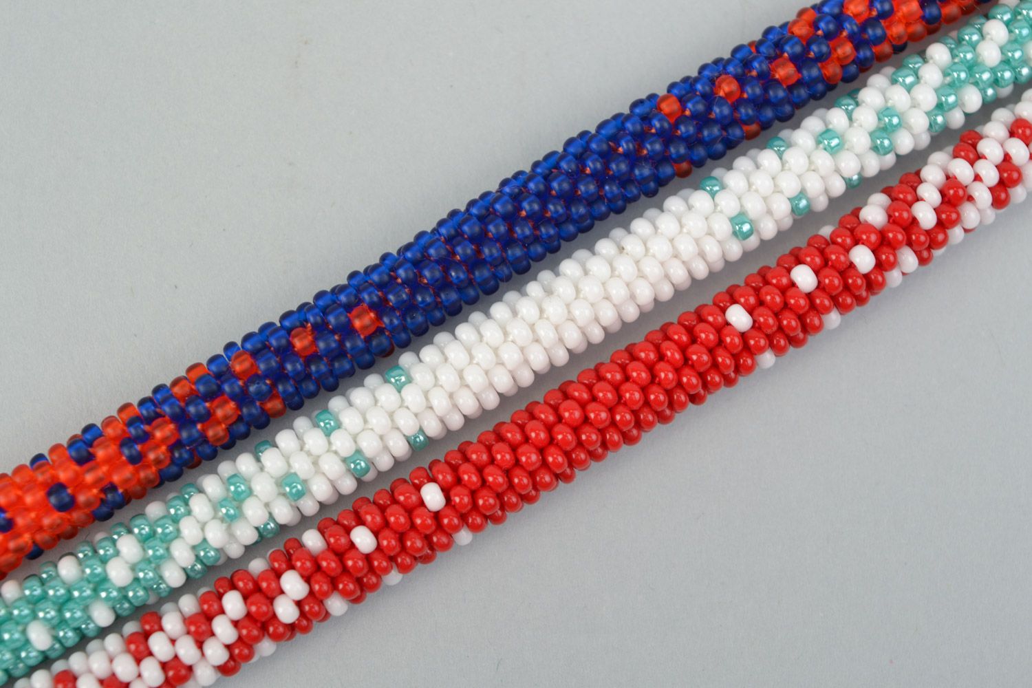 Set of 3 handmade beaded cord bracelets in combinations of white red and blue photo 3