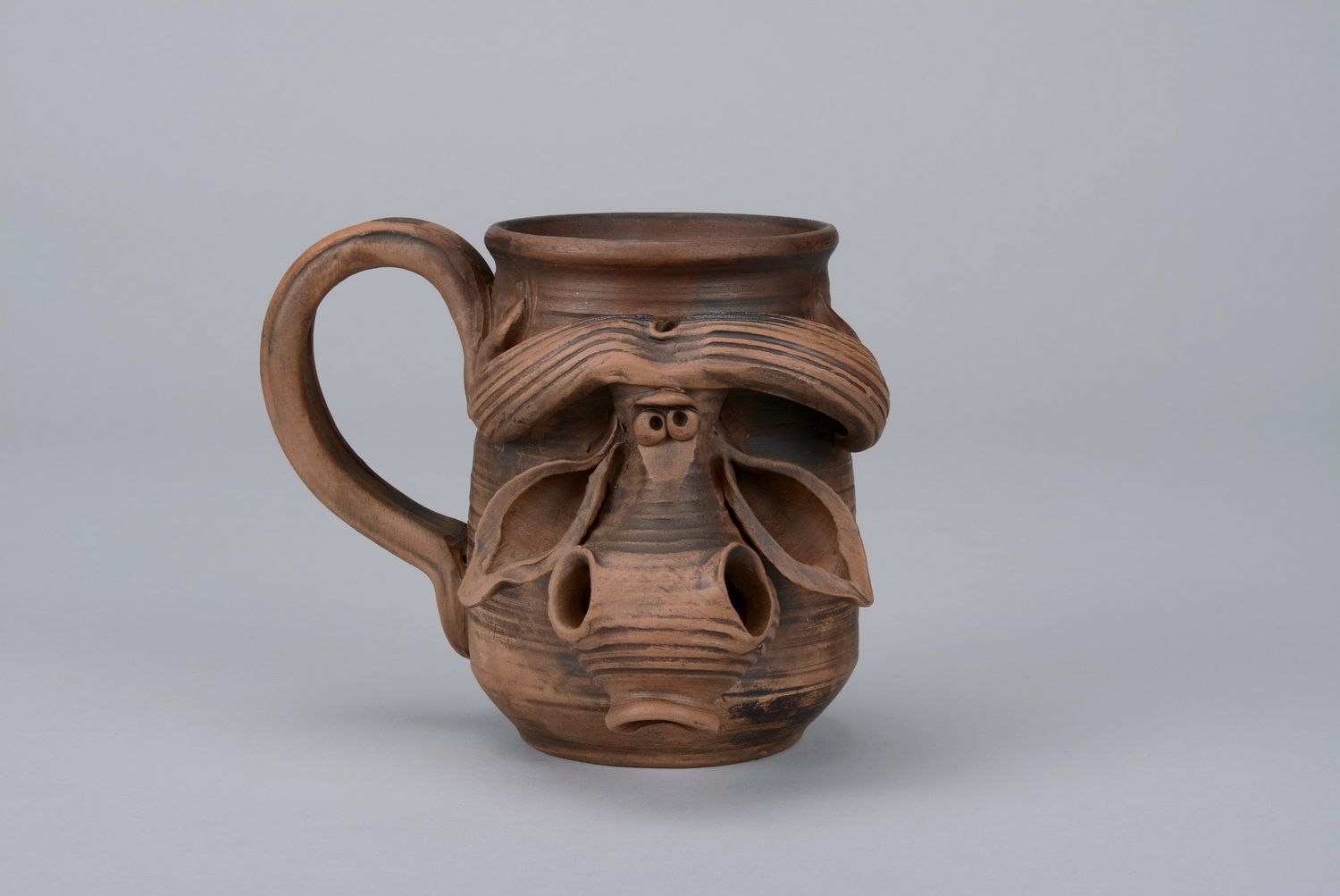10 oz natural clay coffee mug with bull's head and handle in brown color photo 1