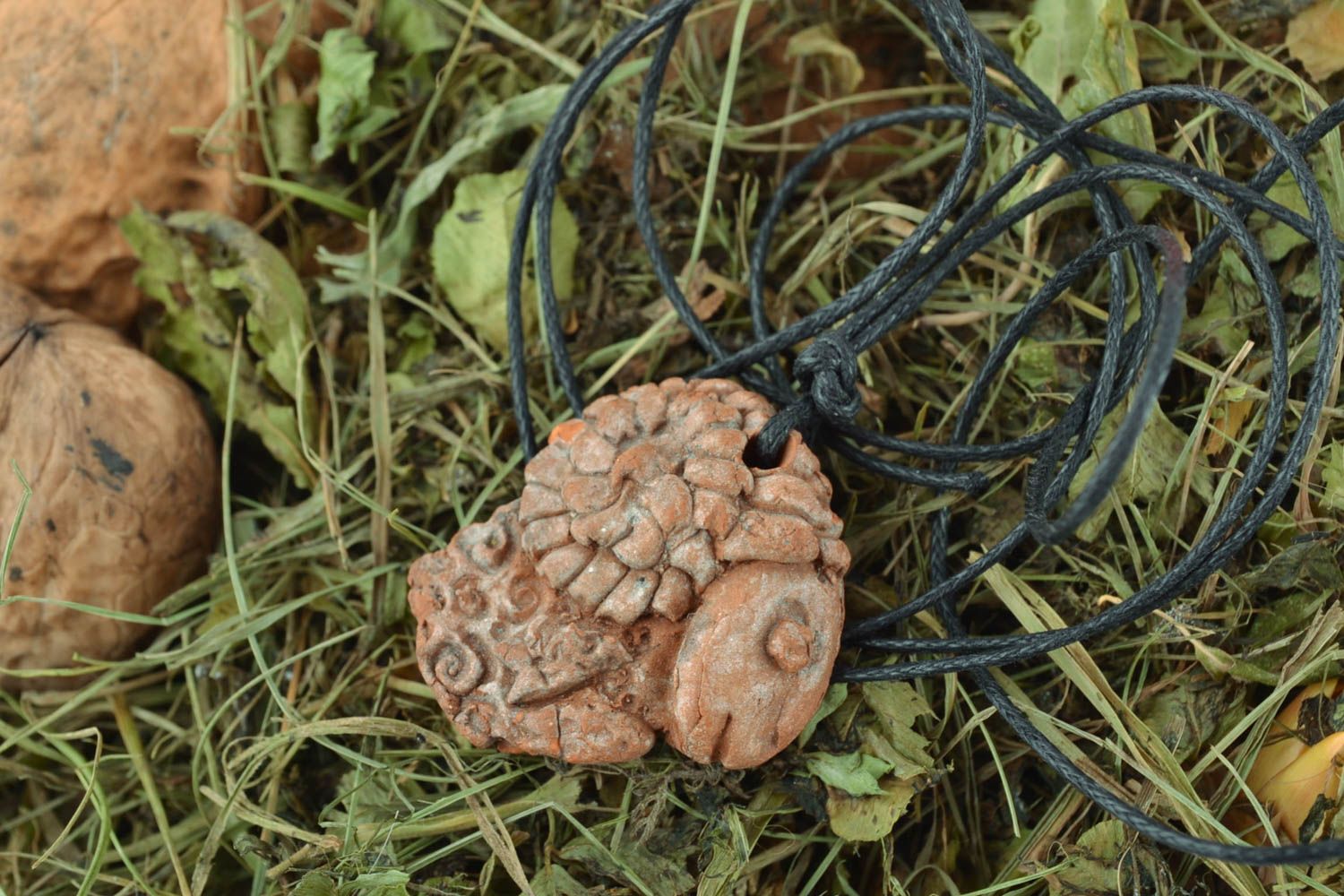 Ethnic clay pendant with cord photo 1