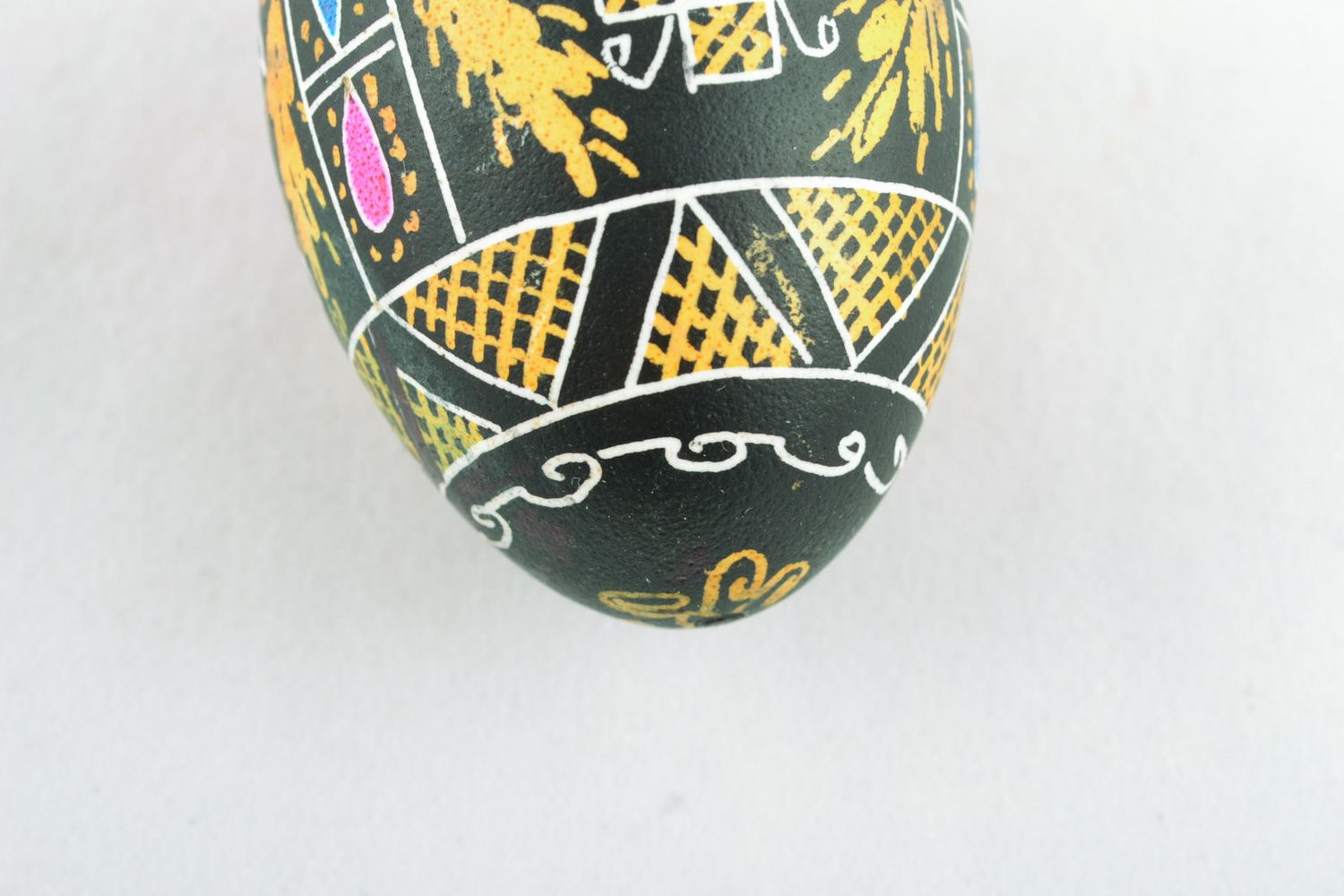 Homemade Easter egg with painting made using waxing technique photo 5
