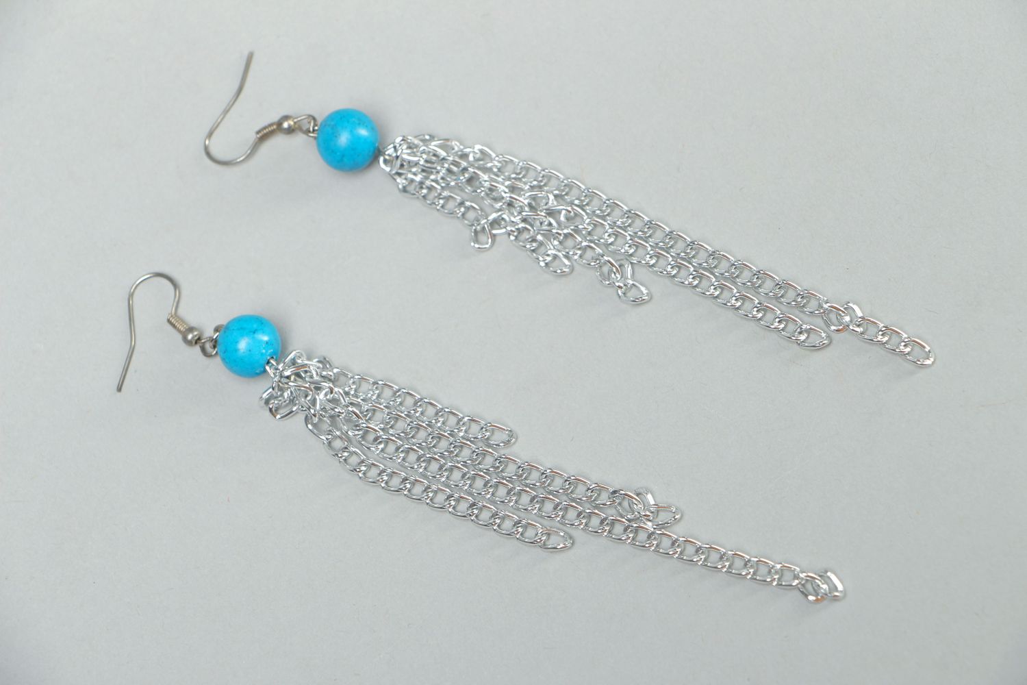 Metal earrings with chains and beads photo 1
