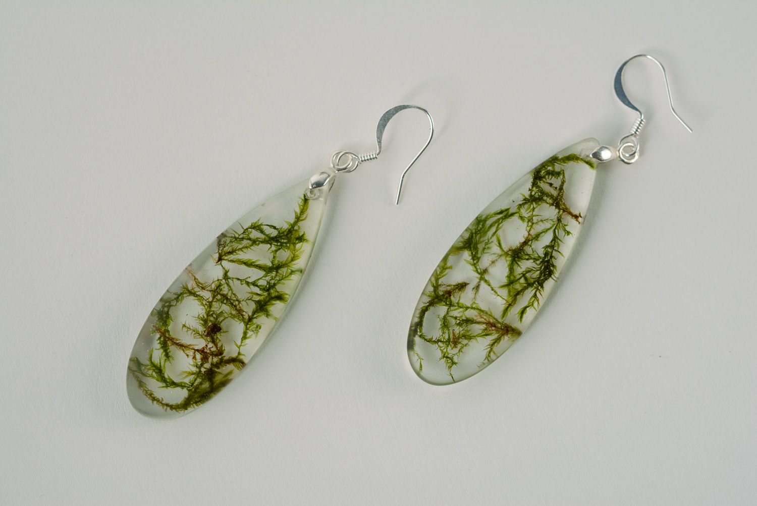 Handmade drop earrings with moss coated with epoxy resin photo 1