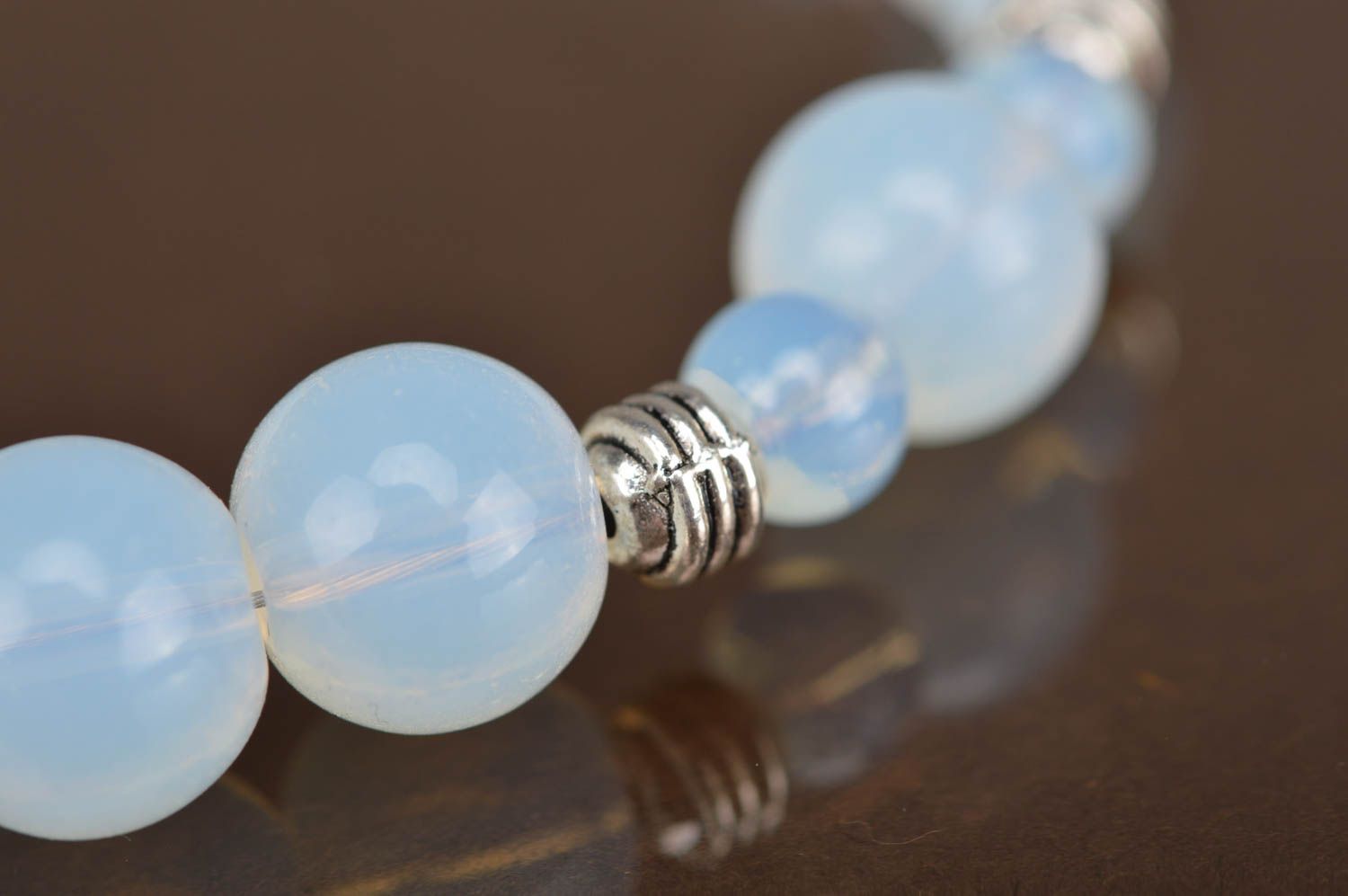 Beautiful women's handmade designer glass bead bracelet of gentle blue color photo 3