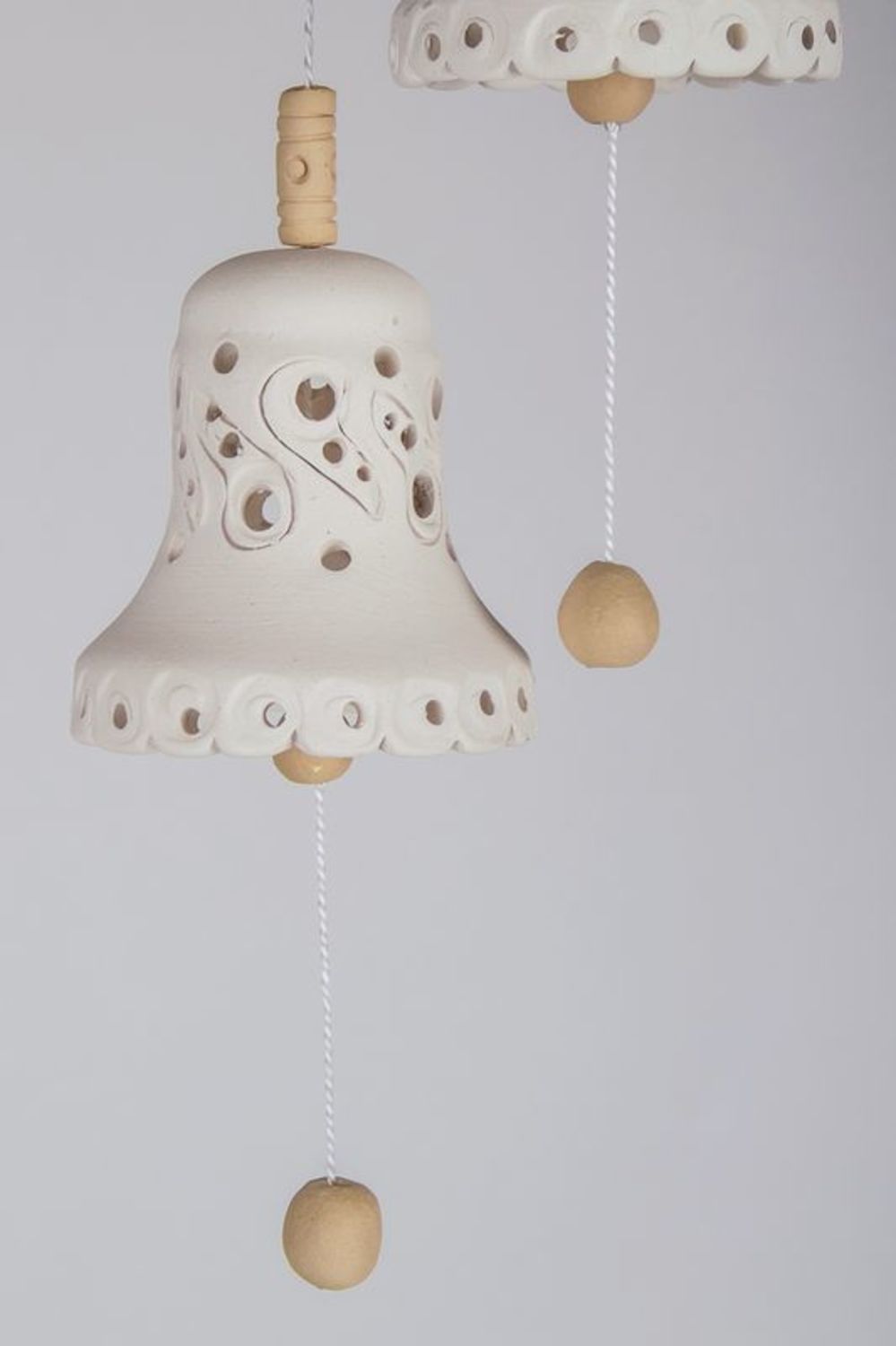 Souvenir bells made from white clay photo 2