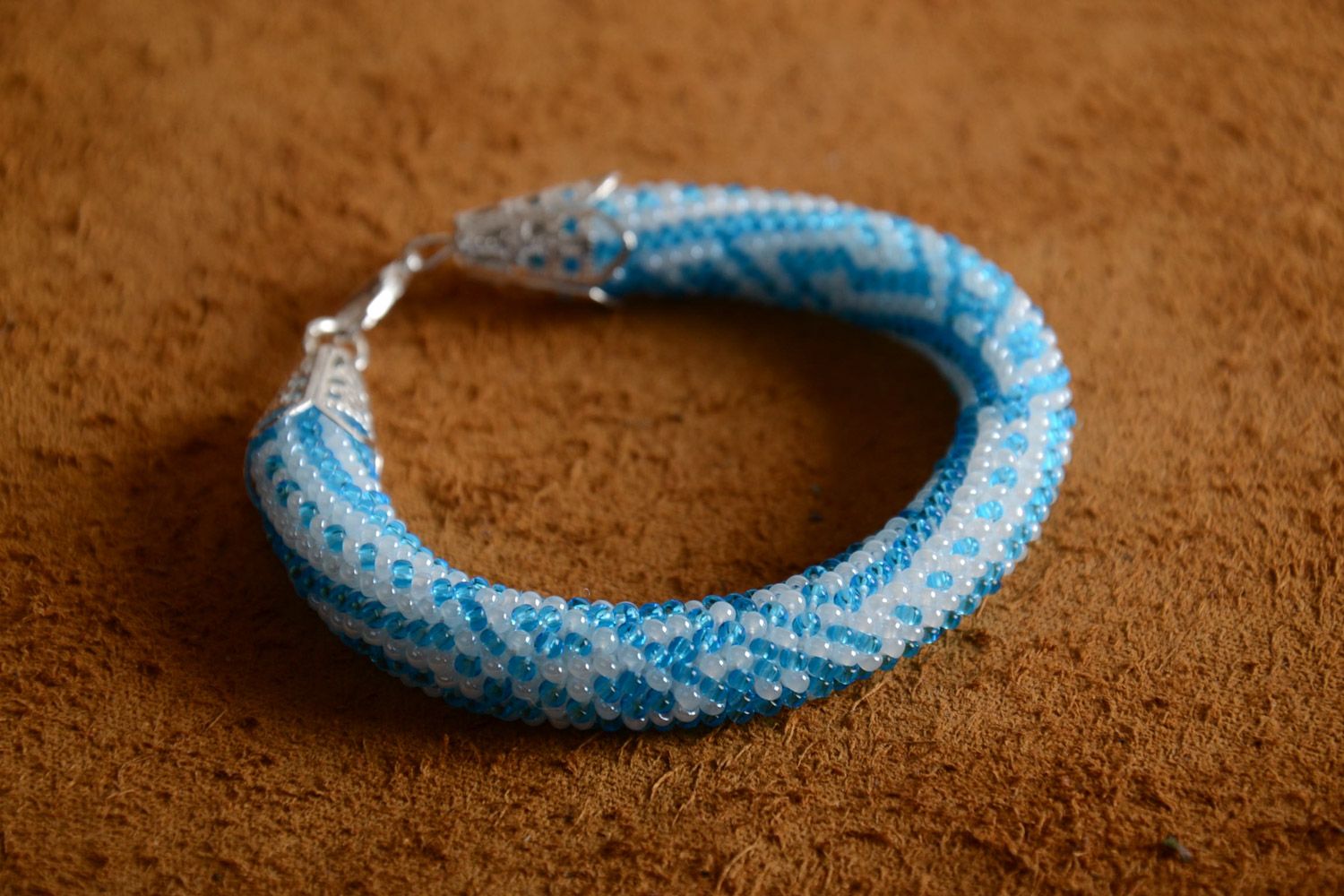 Stylish gentle handmade beaded cord bracelet of white and blue colors for women photo 1