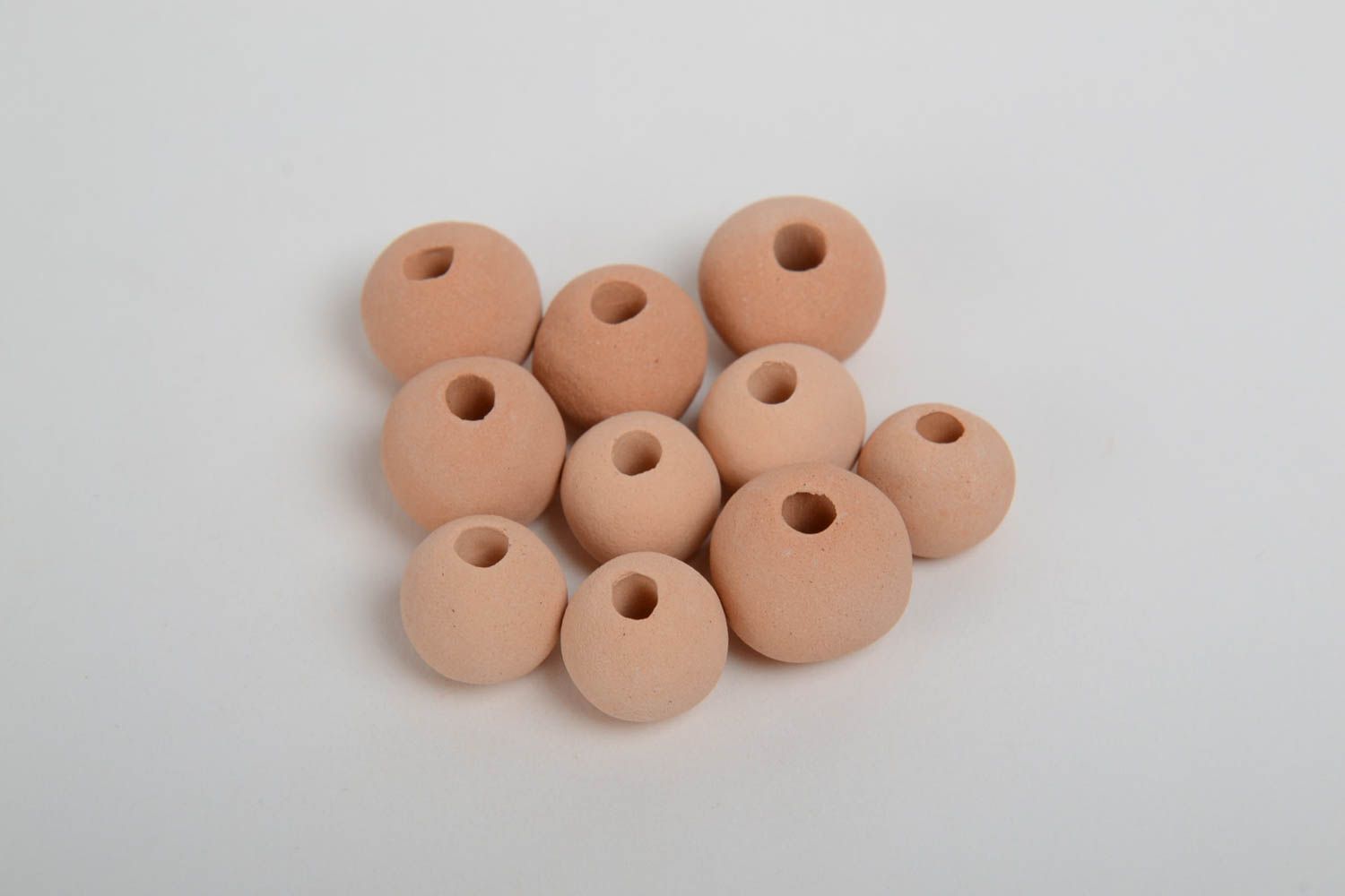 Set of 10 small handmade beige ceramic beads with smooth surface photo 4