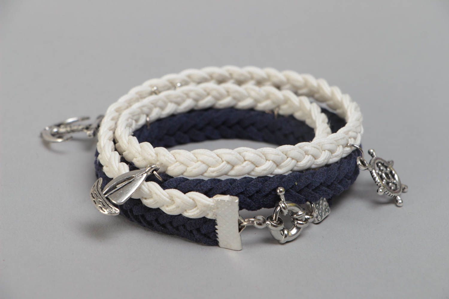 Handmade multi row wrist bracelet woven of suede cord in marine style with charm photo 4