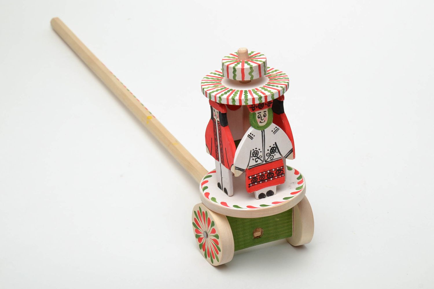 Wooden wheeled toy with Ukrainian ethnic painting The Hutsuls photo 4