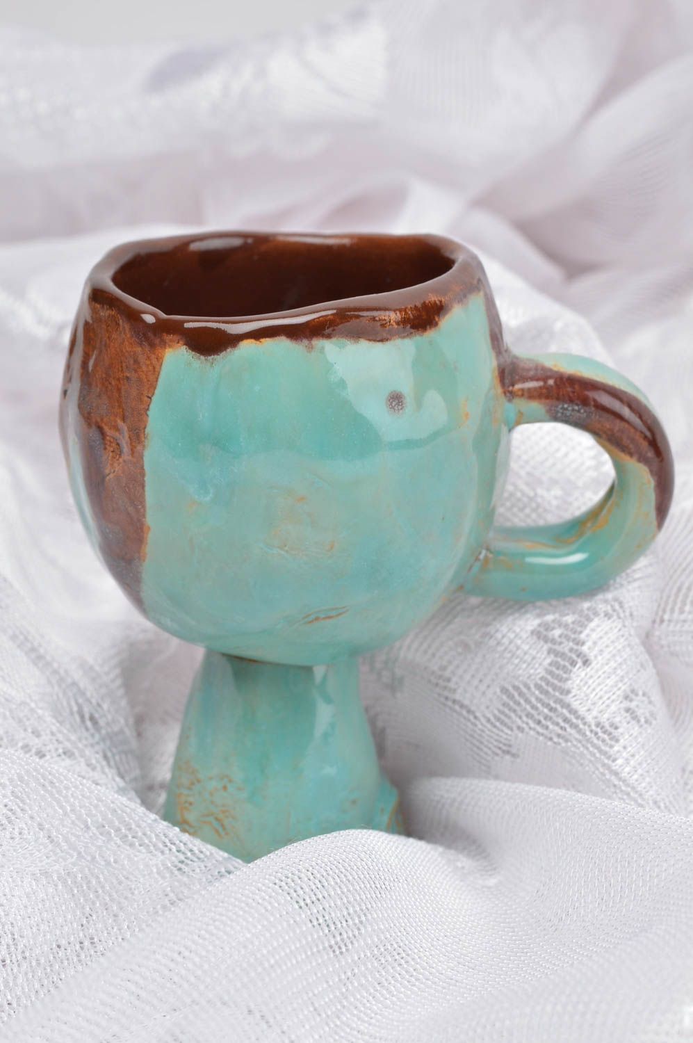 Elegant ancient style ceramic coffee cup on a long stand photo 1