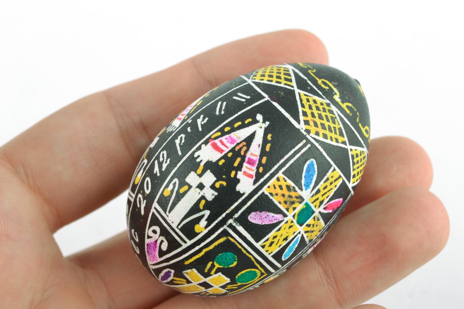 Handmade Easter egg with art painting on black background for interior decoration photo 1