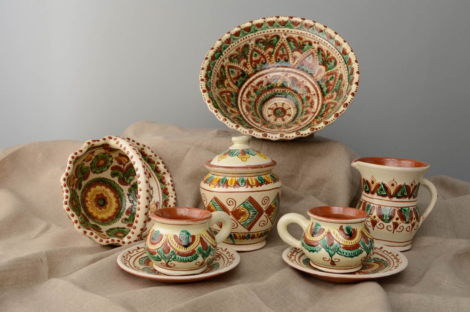 Set of painted ceramic kitchenware photo 1