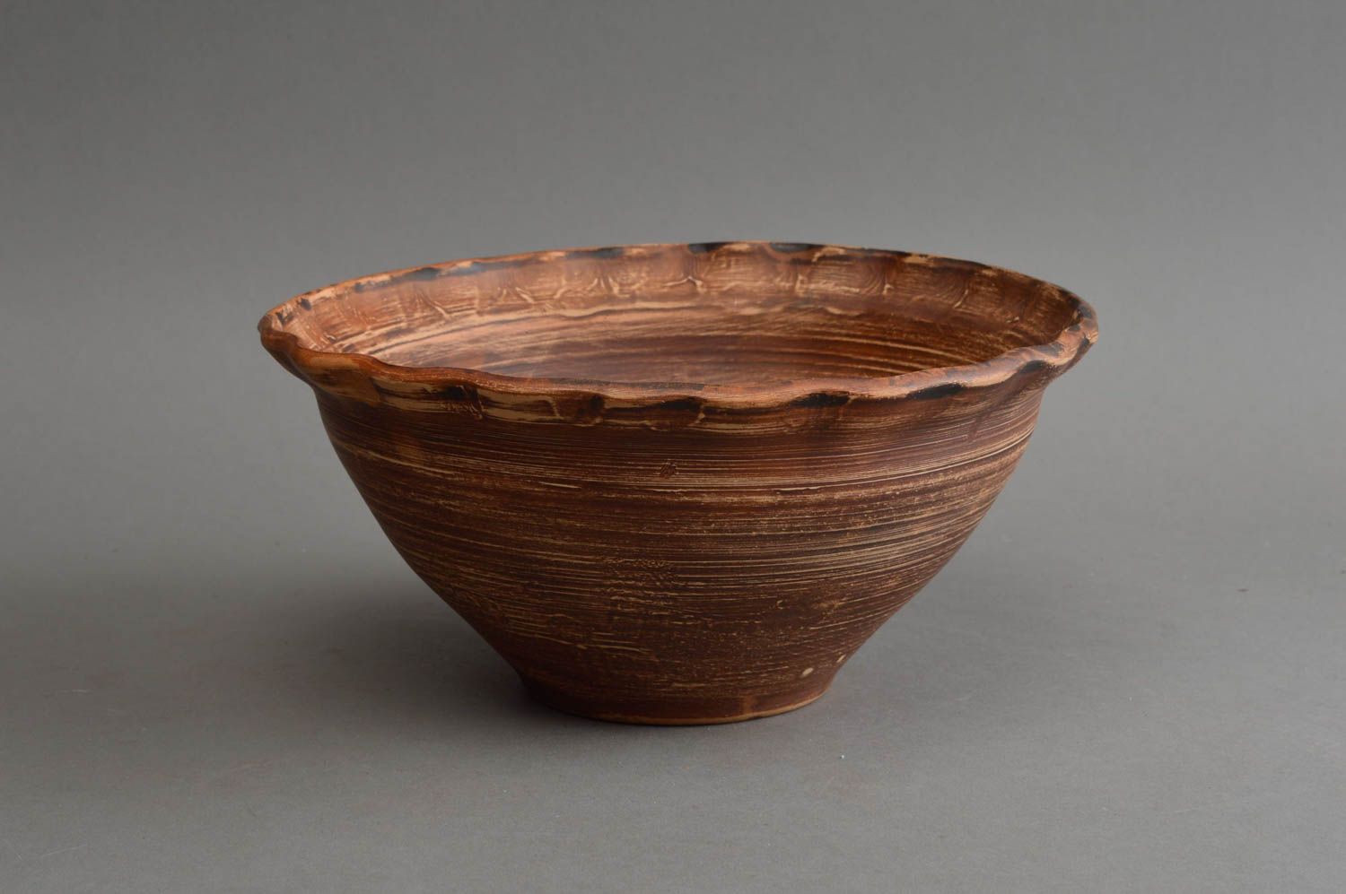 Handmade stylish ethnic ceramic tall bowl with waved edge and narrow bottom photo 2