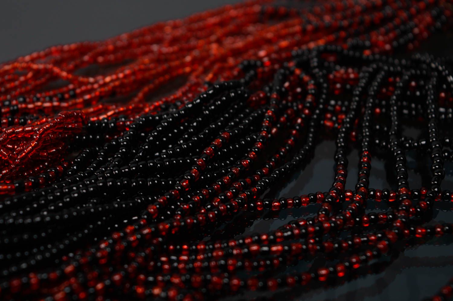 Multi-row beaded necklace of red and black colors photo 5