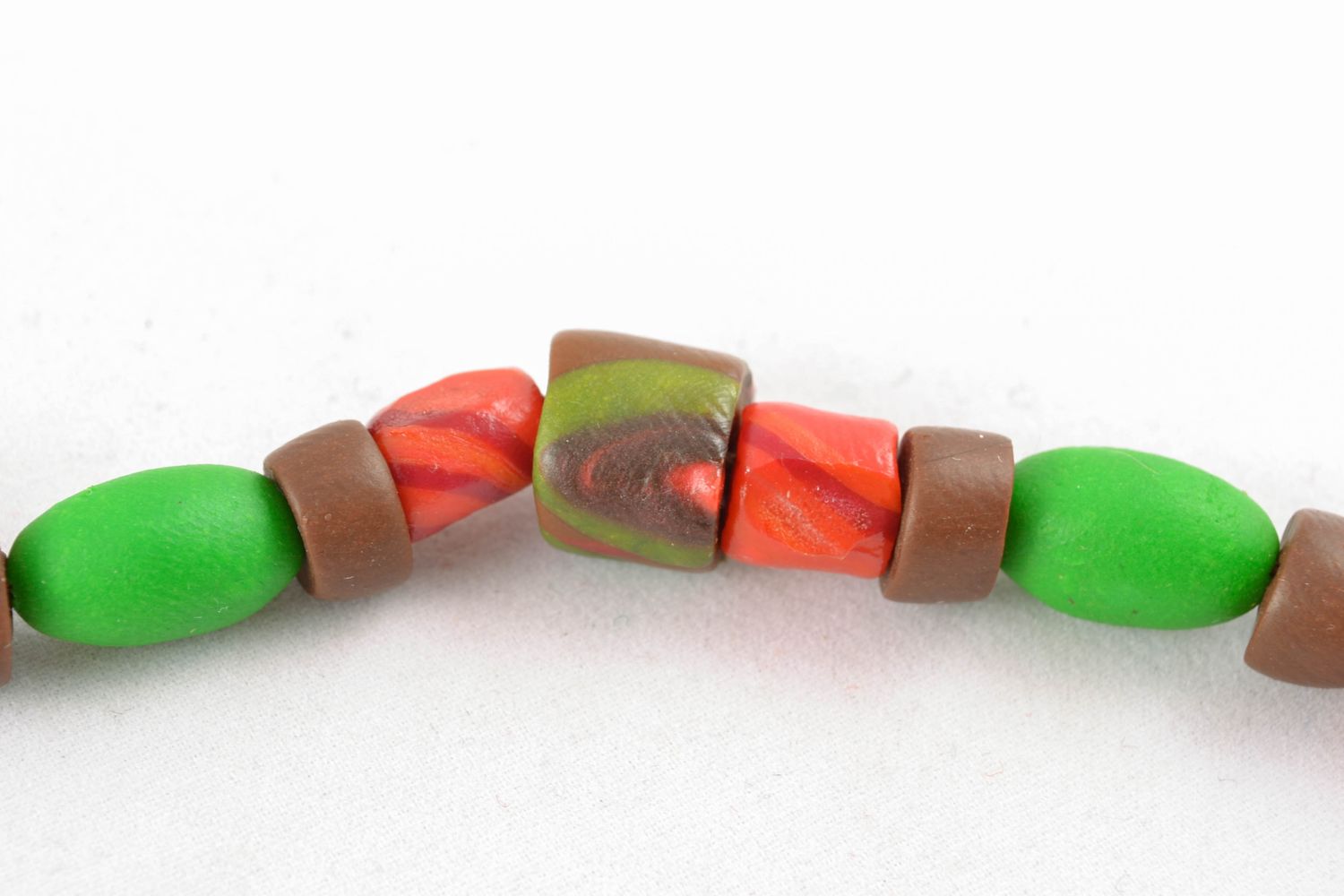 Clay beads necklace in light green, brown and red colors photo 3