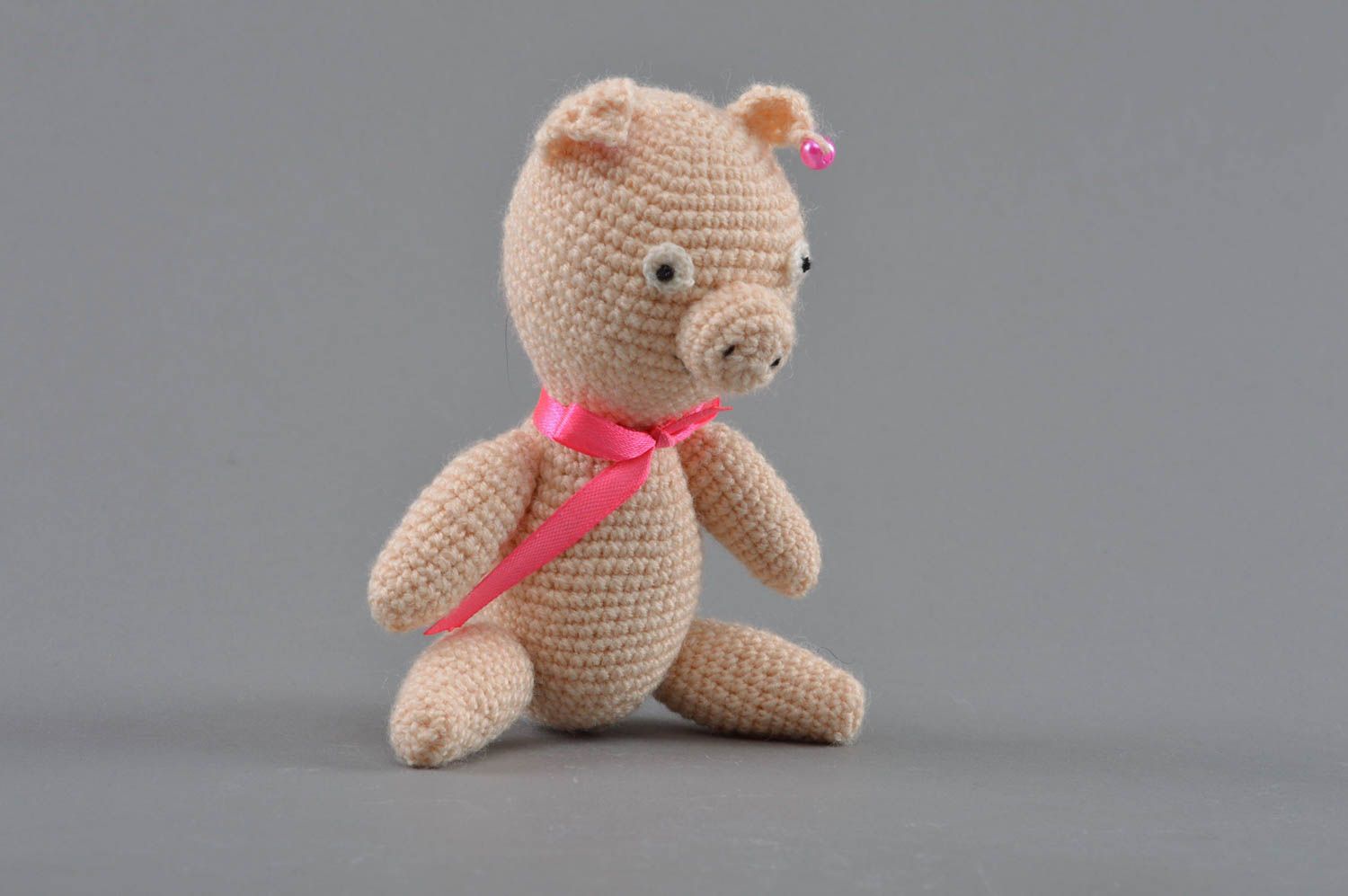 Soft crocheted toy pig with a bow of beige color handmade home decor photo 2