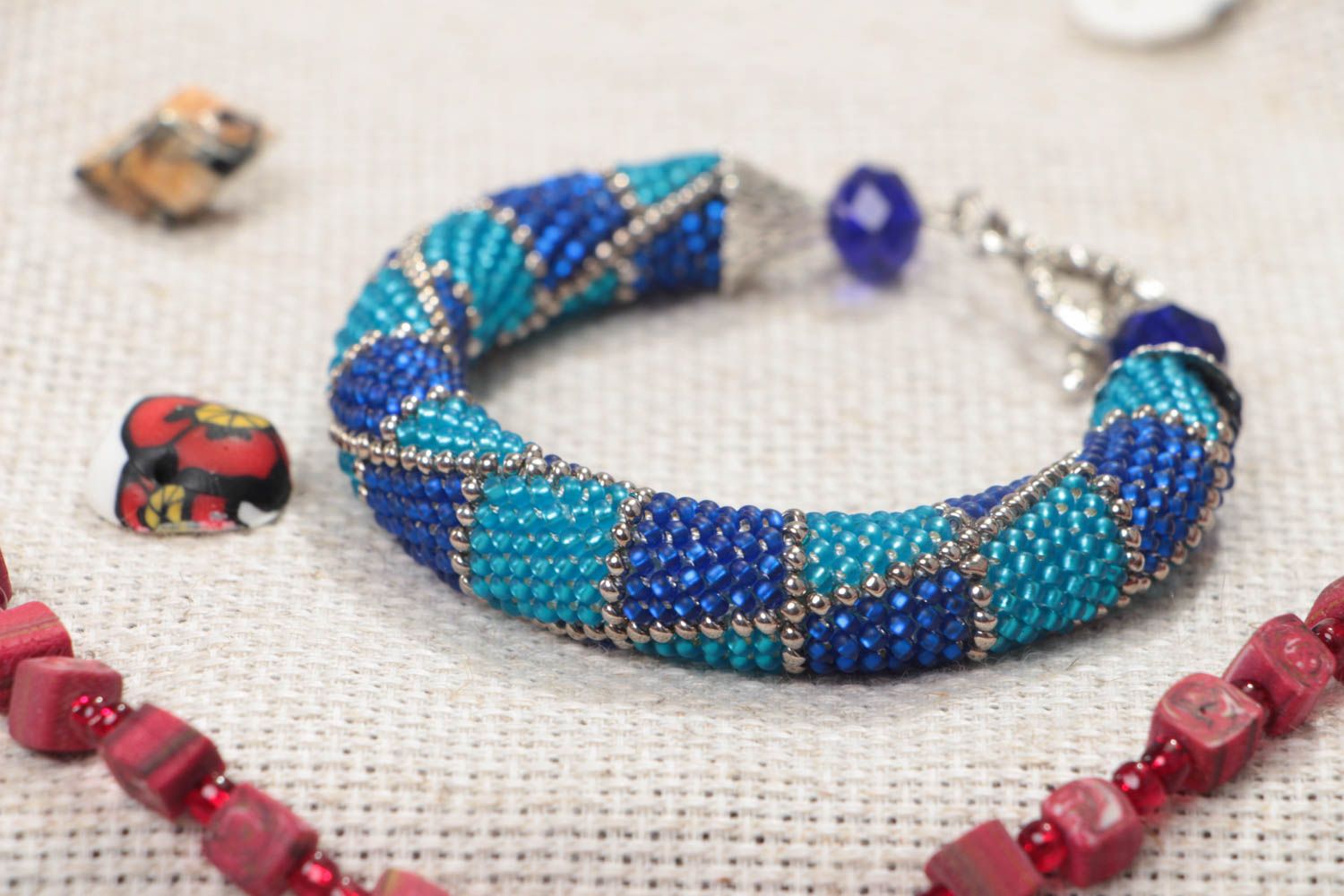 Handmade designer wrist beaded cord bracelet in blue color palette for women photo 1