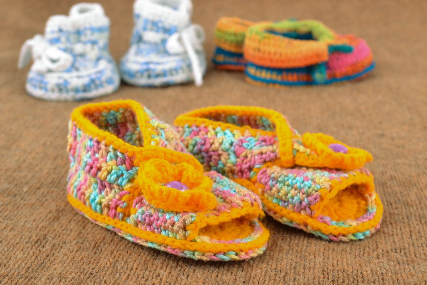 Multi-colored handmade knitted baby booties sandals with yellow flower photo 1