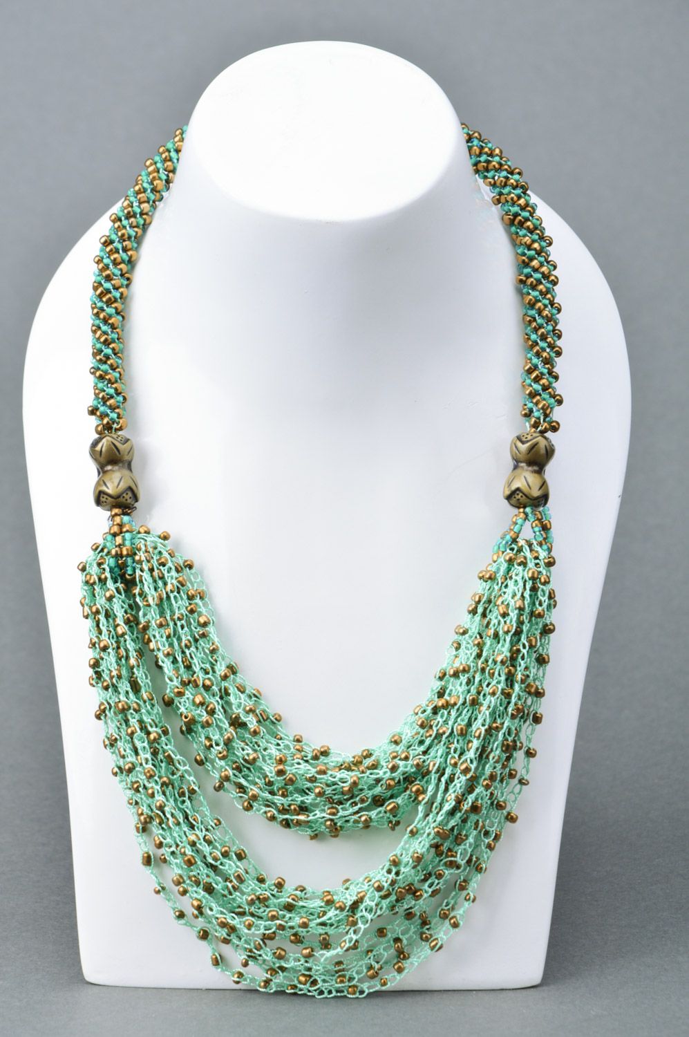 Beautiful women's handmade beaded necklace in gold and green colors photo 1