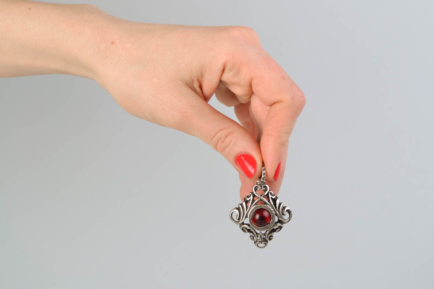 Metal pendant with red glass cabochon photo 2
