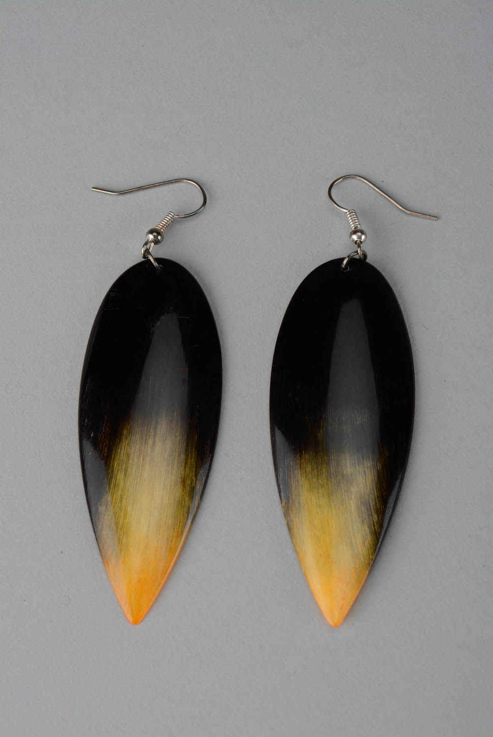 Cow horn earrings of yellow and black color Arrow photo 1