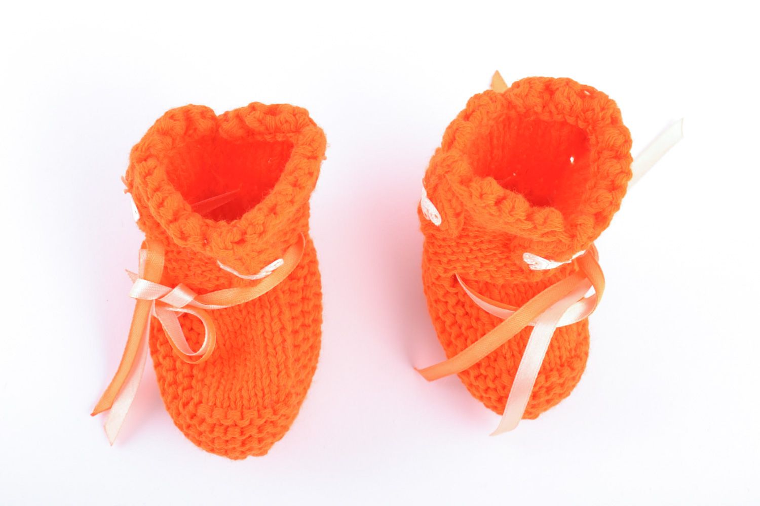 Handmade knitted wool baby bootees of orange color photo 5