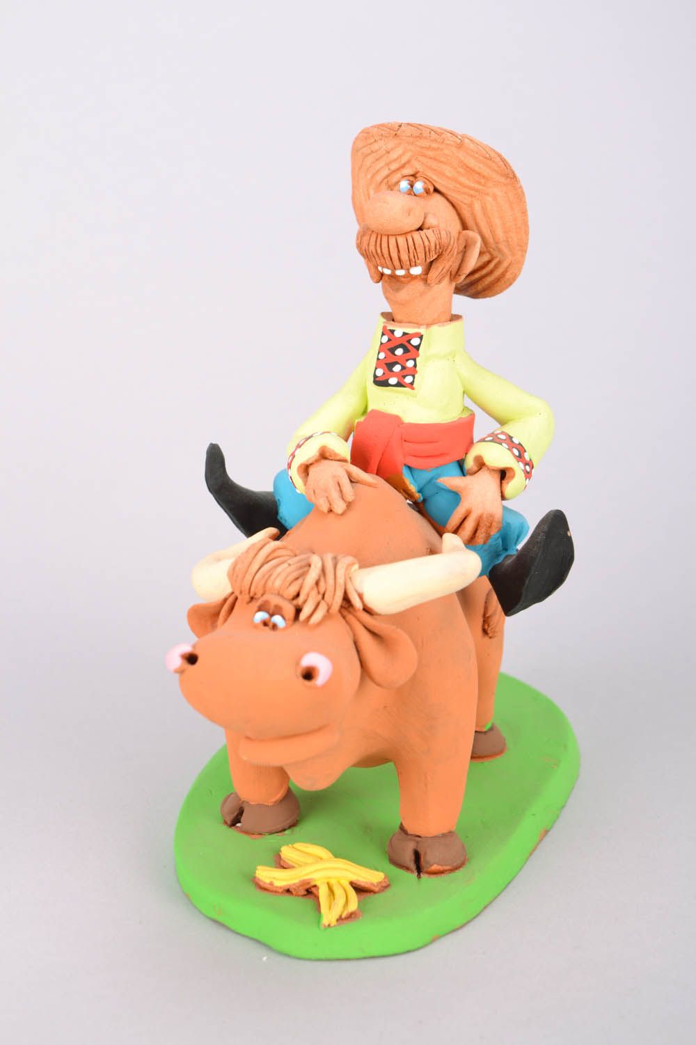 Homemade clay statuette Cossack riding a bull photo 3