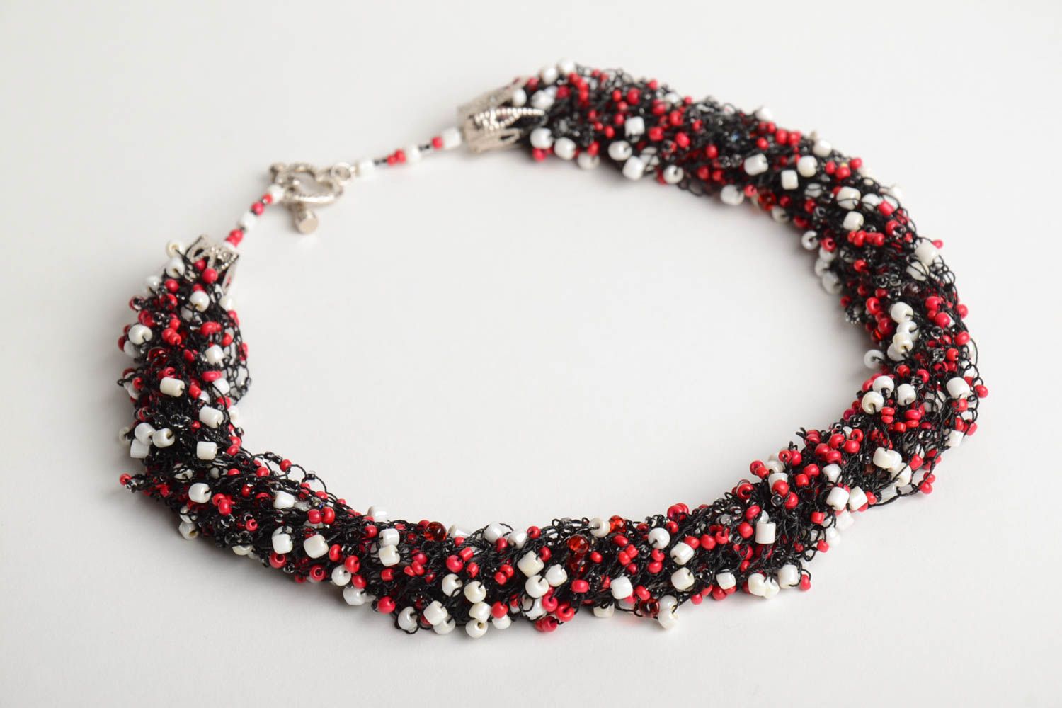 Handmade volume airy necklace crocheted of beads in white red and black colors photo 3