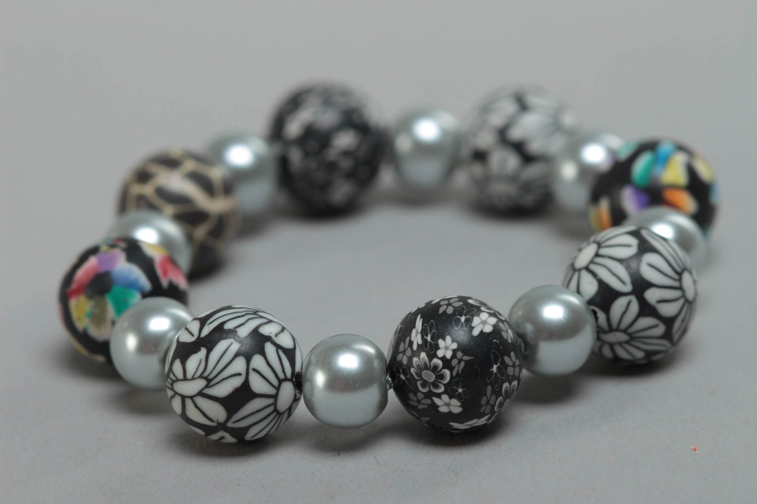 Beautiful gray handmade designer children's plastic bracelet with ceramic pearls photo 3