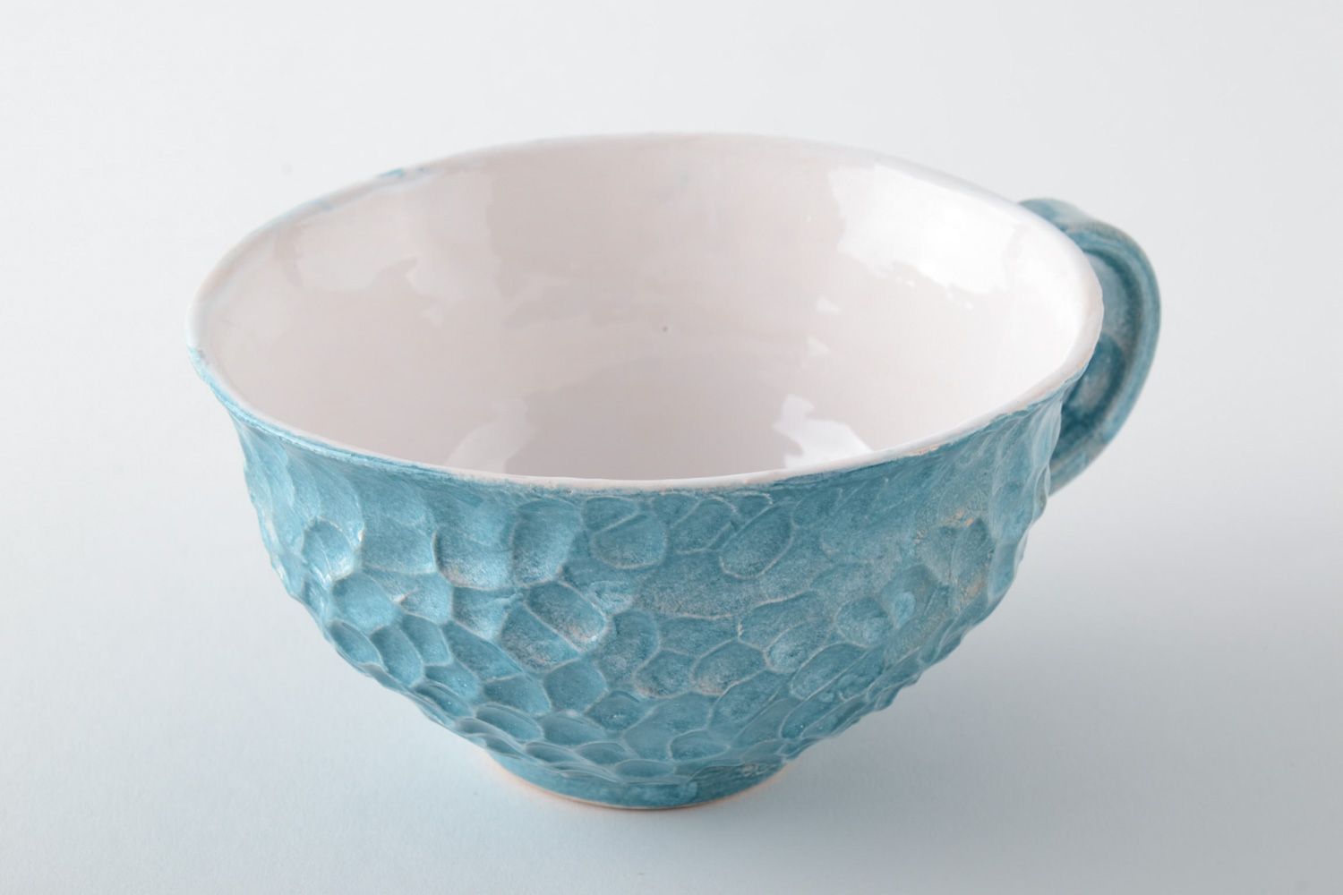 Light blue elegant teacup with handle and molded pattern photo 3