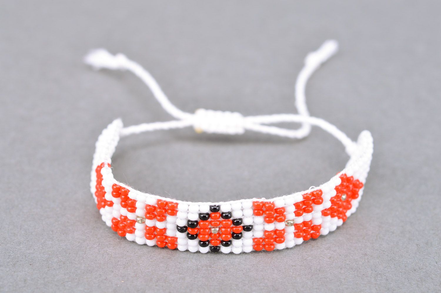 Handmade women's woven bead bracelet of white color with ornament photo 2