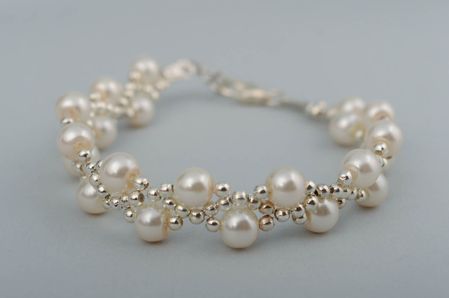 Stylish handmade designer artificial pearl beaded bracelet of white color photo 3