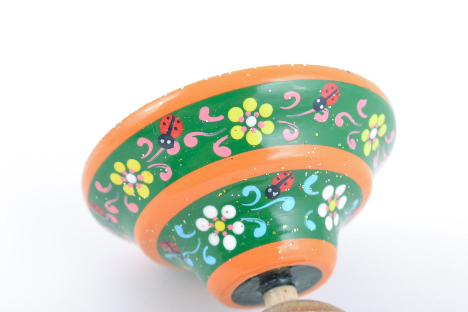 Homemade wooden ornamented toy spinning top painted with eco dyes for children photo 4