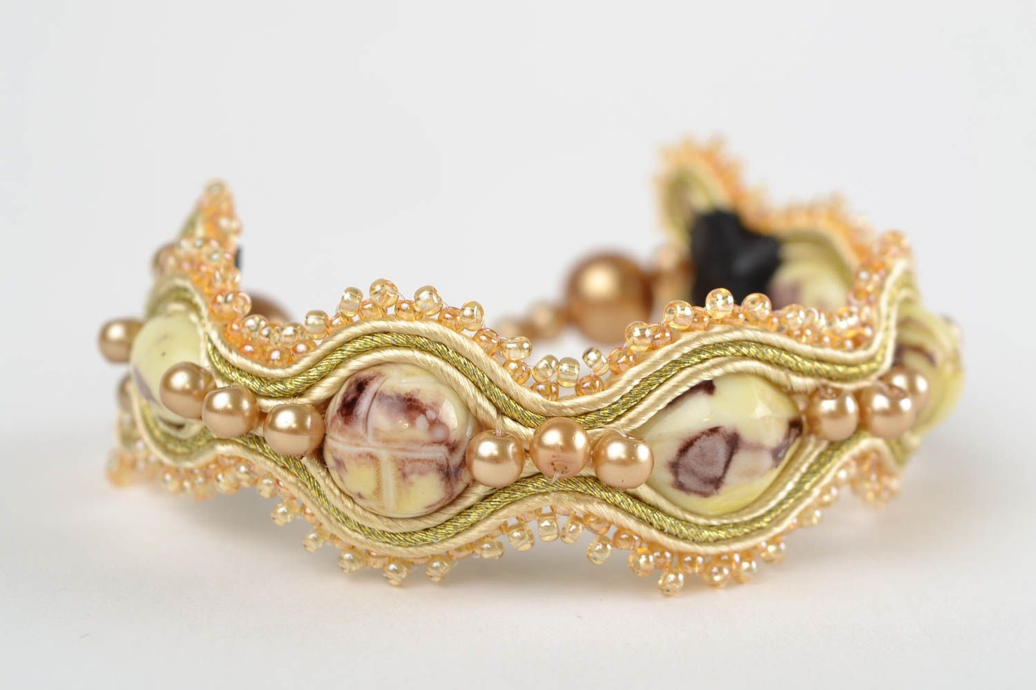 Handmade designer beige soutache wrist bracelet with polymer clay elements photo 3