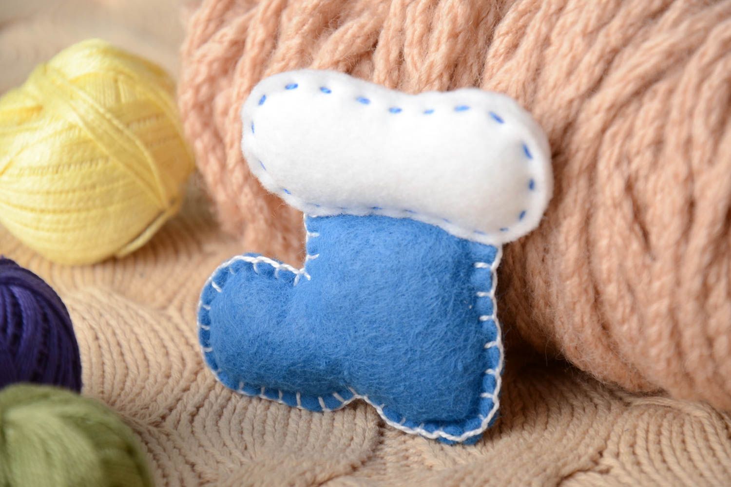Handmade small soft toy in the shape of bootie sewn of blue and white felt photo 1