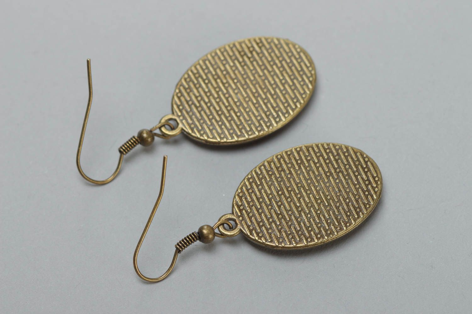 Handmade vintage metal earrings of oval shape with patterns coated with glaze photo 4